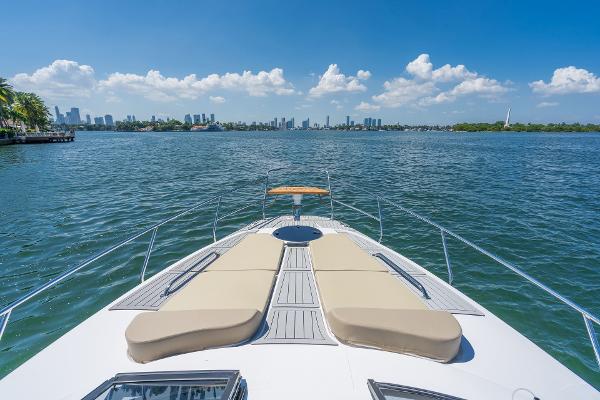 Slide: The Image of 2025 Hanover 375 yacht cruising on a sunny day with city skyline in the background. - 10