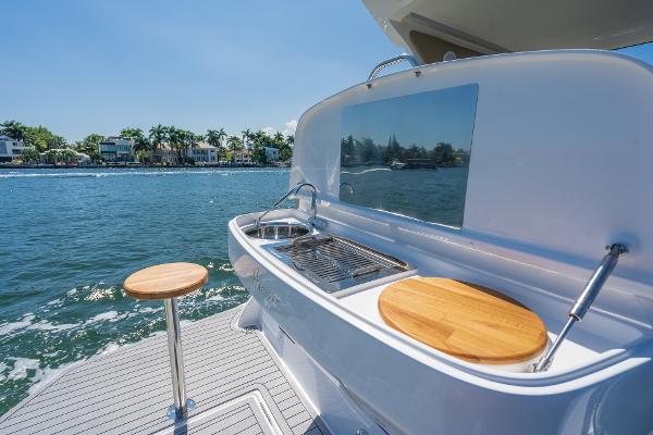 Slide: The Image of Outdoor kitchen on Hanover 375 yacht, featuring grill and sink, with ocean view. - 14