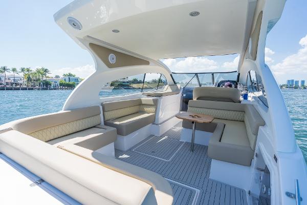 Slide: The Image of Luxurious 2025 Hanover 375 yacht interior with spacious seating and elegant design on open water. - 16