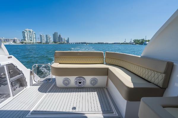 Slide: The Image of Luxurious seating on a 2025 Hanover 375 yacht with city skyline view. - 19