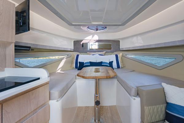 Slide: The Image of Luxurious interior of 2025 Hanover 375 yacht with elegant seating and wooden table. - 25