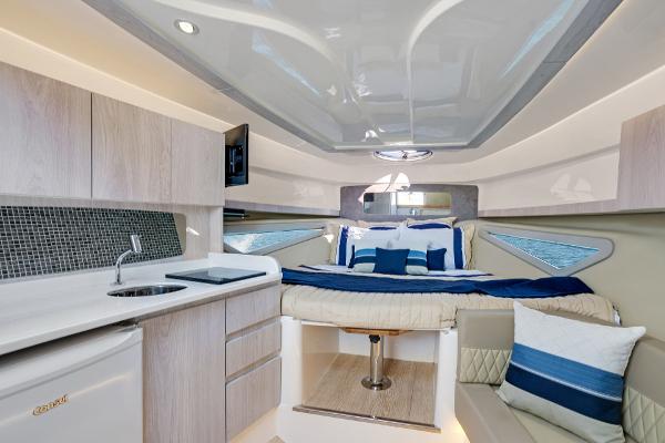 Slide: The Image of Luxurious interior of 2025 Hanover 375 yacht with modern kitchen and cozy sleeping area. - 26