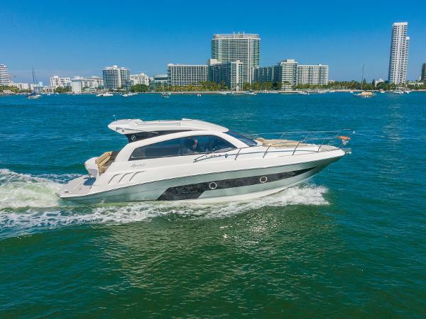 Slide: The Image of 2025 Hanover 375 yacht cruising on blue water near city skyline. - 3