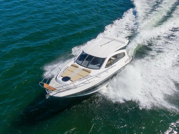 Slide: The Image of Aerial view of 2025 Hanover 375 yacht cruising on open water. - 8