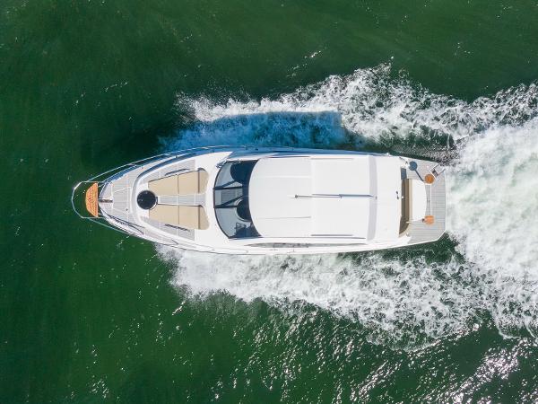 Slide: The Image of Aerial view of 2025 Hanover 375 yacht cruising on green water. - 9