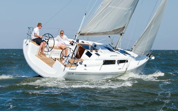 Slide: The Image of 2024 Hanse 315 sailboat cruising on open water. - 1
