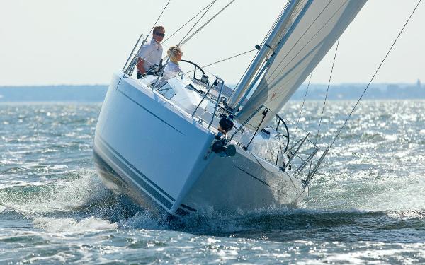 Slide: The Image of 2024 Hanse 315 sailboat navigating through waves. - 2