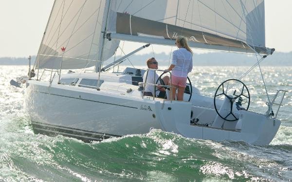 Slide: The Image of 2024 Hanse 315 sailboat cruising on the ocean with two people onboard. - 4