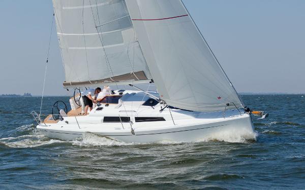 Slide: The Image of 2024 Hanse 315 sailboat cruising on open water. - 5
