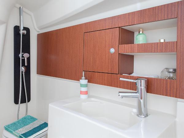 Slide: The Image of Modern bathroom in 2024 Hanse 315 yacht with sleek sink and wooden cabinets. - 8