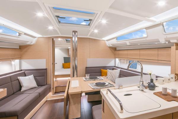 Slide: The Image of Luxurious interior of 2025 Hanse 418 yacht with modern kitchen and seating area. - 7