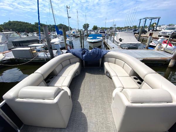 Slide: The Image of 2017 Harris 240 Cruiser boat interior at marina with docked boats. - 4
