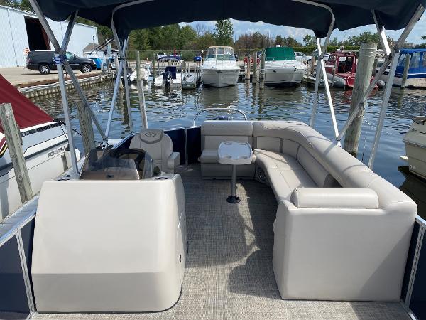 Slide: The Image of 2017 Harris 240 Cruiser pontoon boat docked at a marina. - 7