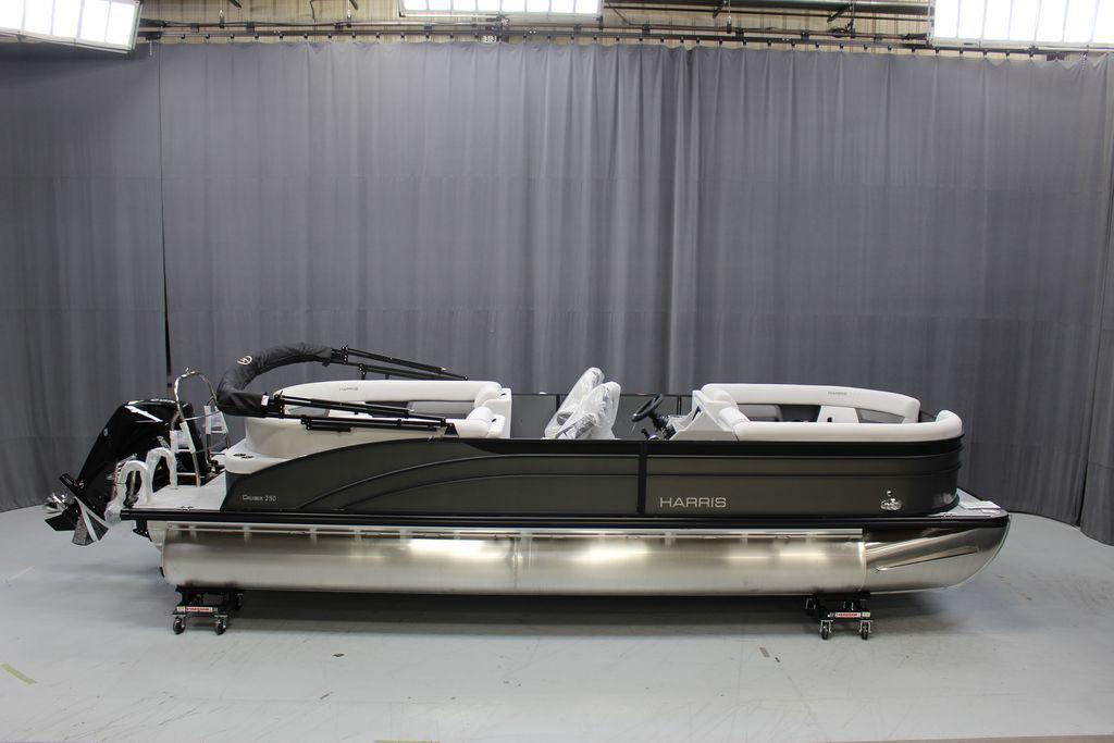 Slide: The Image of 2023 Harris Cruiser 250 CWDH pontoon boat in showroom. - 0