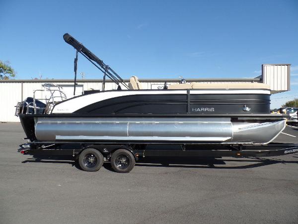 Slide: The Image of 2024 Harris Sunliner 230 pontoon boat on a trailer. - 1