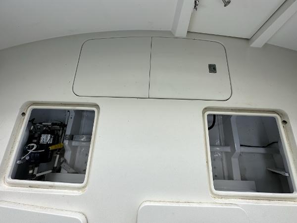 Slide: The Image of 1986 Hatteras 52 Convertible boat deck with open storage compartments. - 16