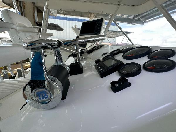Slide: The Image of Control panel of 1986 Hatteras 52 Convertible yacht with gauges and navigation equipment. - 24