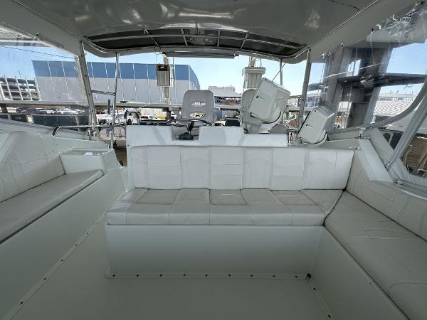 Slide: The Image of Interior view of 1986 Hatteras 52 Convertible yacht with white seating. - 28