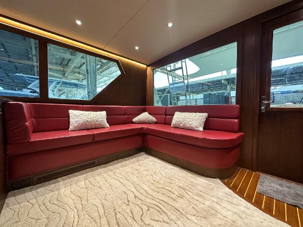 Slide: The Image of Luxurious interior of 1986 Hatteras 52 Convertible yacht with red leather seating. - 32