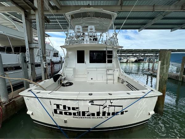 Slide: The Image of 1986 Hatteras 52 Convertible yacht docked, named "The Godfather," Galveston Island, TX. - 4