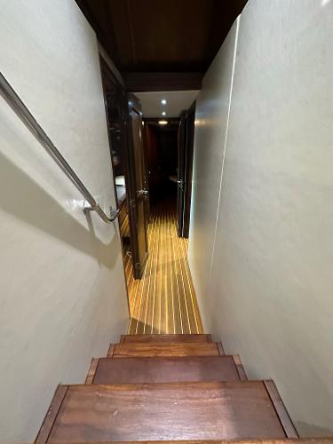Slide: The Image of Interior hallway of 1986 Hatteras 52 Convertible yacht with wooden flooring. - 44