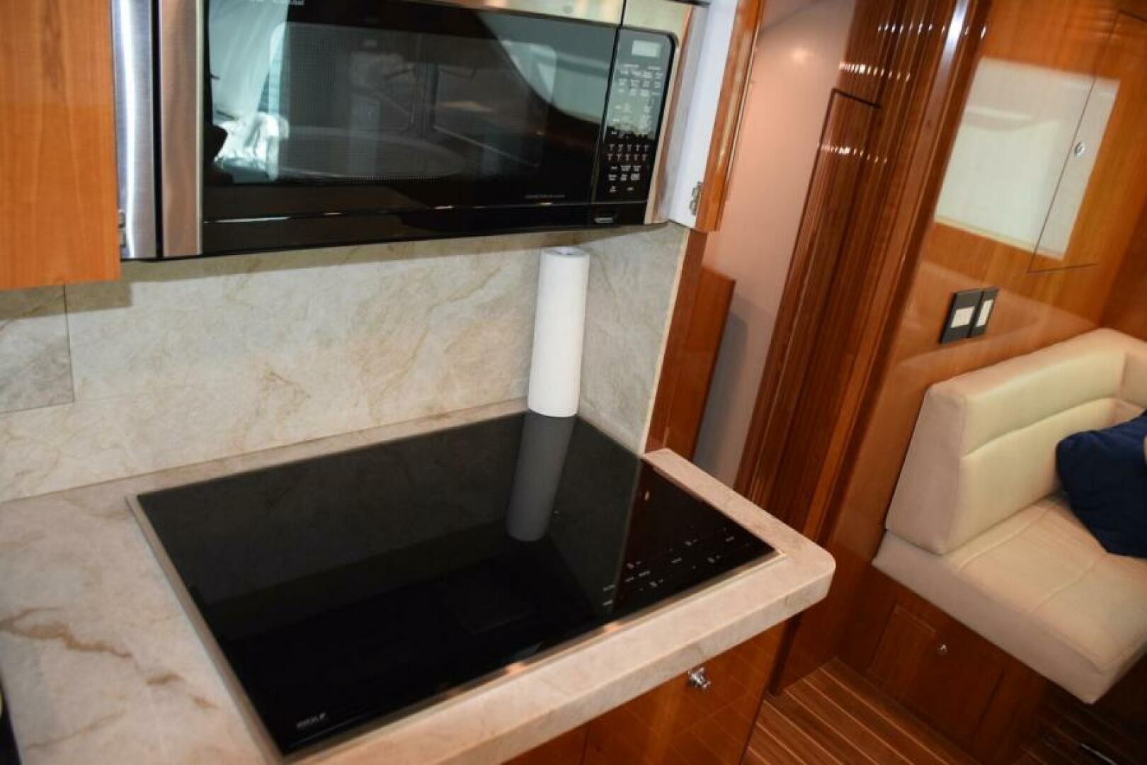 Slide: The Image of Microwave Convention Behind Cabinet above Stovetop   - 5133521