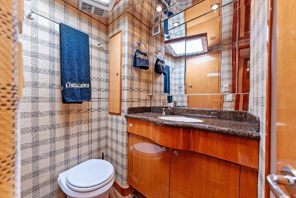 Slide: The Image of Luxurious bathroom in 2007 Hatteras 64 Convertible yacht with wood cabinetry and granite countertop. - 18