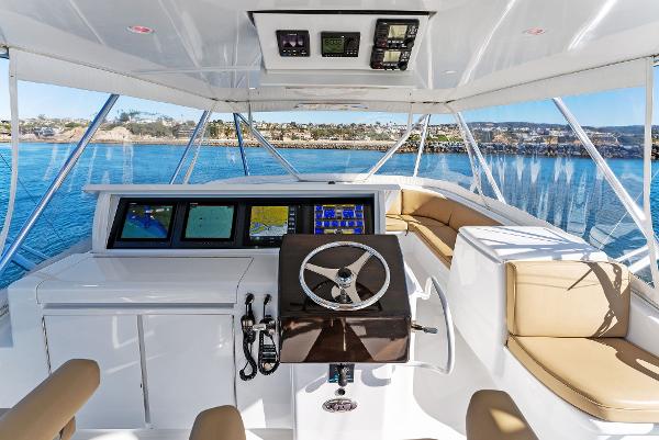Slide: The Image of Helm of 2007 Hatteras 64 Convertible yacht with panoramic ocean view. - 3
