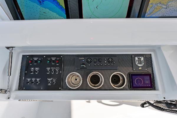 Slide: The Image of Control panel of a 2007 Hatteras 64 Convertible yacht with navigation screens. - 38