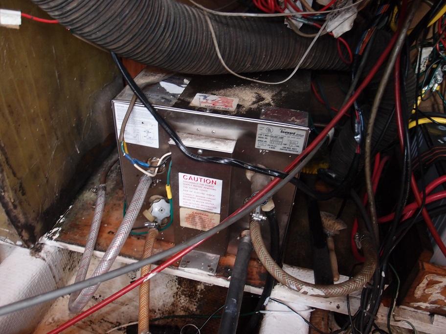 Slide: The Image of Electrical wiring and equipment inside a 1961 Hatteras Convertible boat. - 27