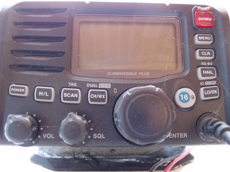 Slide: The Image of Close-up of a marine radio control panel on a 1961 Hatteras Convertible boat. - 28