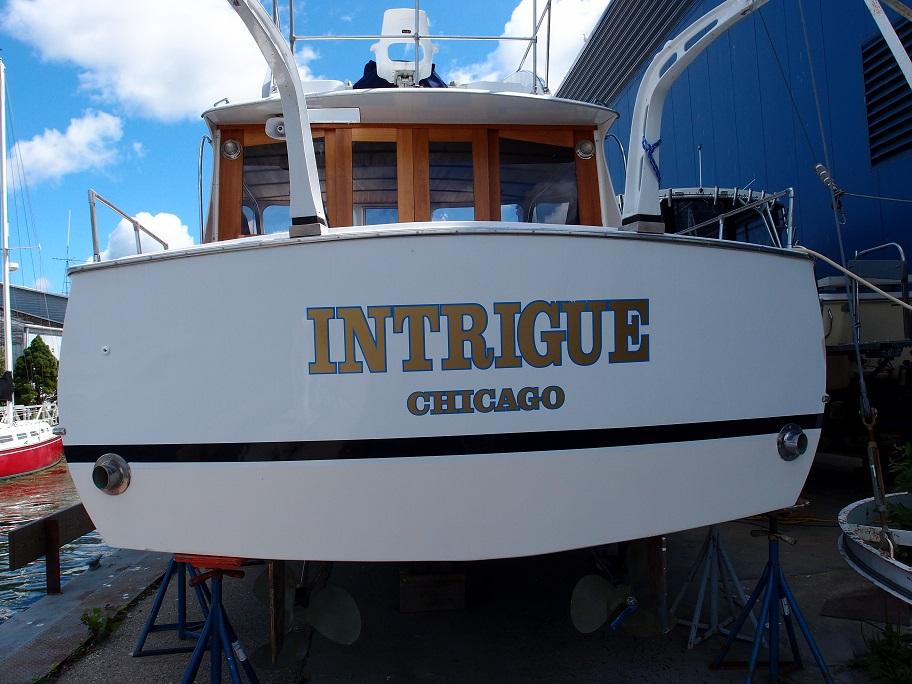 Slide: The Image of 1961 Hatteras Convertible boat named Intrigue docked in Chicago. - 5