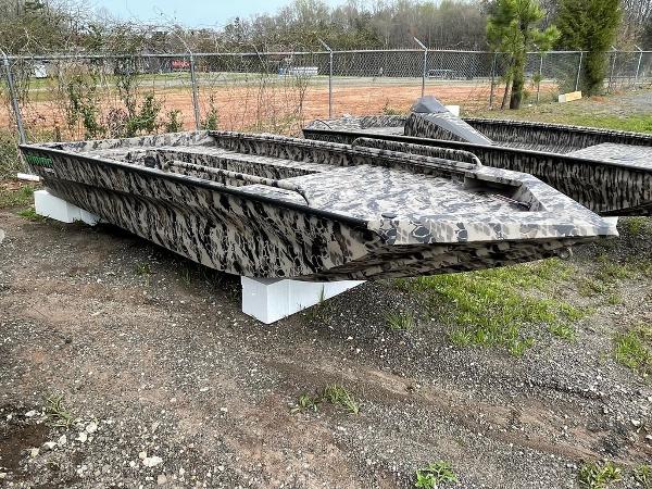 Slide: The Image of 2022 Havoc 1860 Dbst boat with camouflage design on display outdoors. - 4