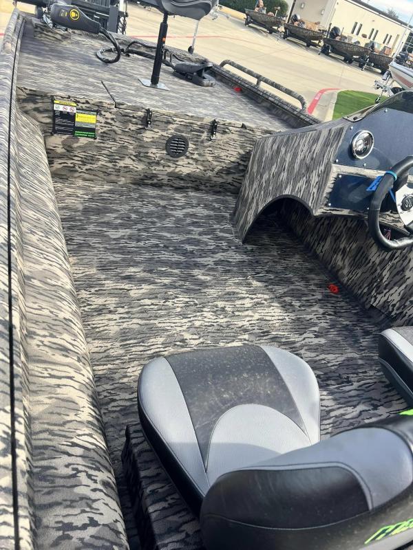 Slide: The Image of 2024 Havoc Boats 1756 FRRSCST interior with camo pattern and seating. - 11