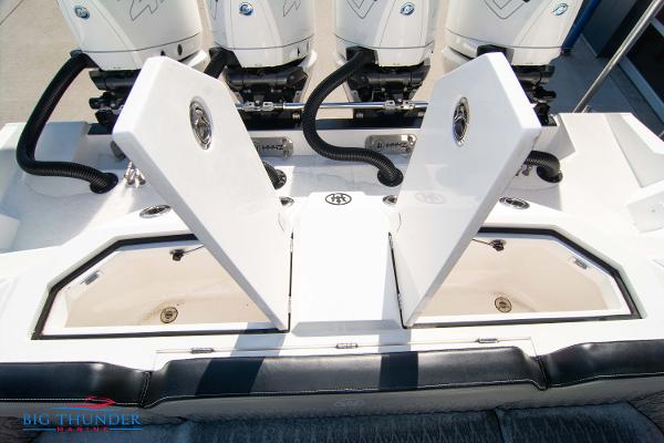 Slide: The Image of 2023 Hayaari Marine H44Z boat with open storage compartments and powerful engines. - 20