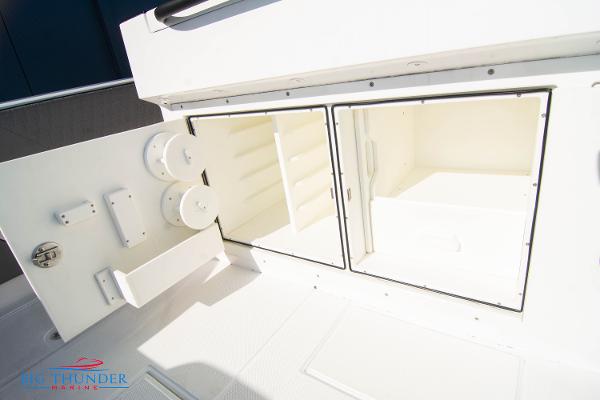Slide: The Image of Hayaari Marine H44Z 2023 model storage compartments with open doors. - 29