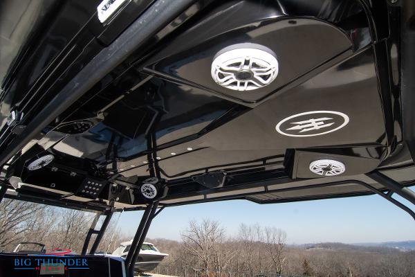 Slide: The Image of 2023 Hayaari Marine H44Z boat with sleek black interior and advanced audio system. - 38