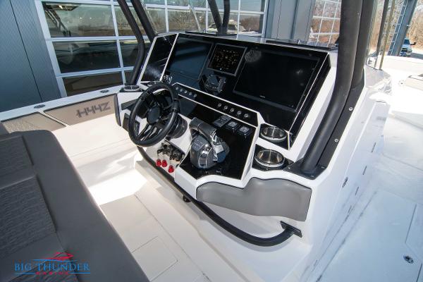 Slide: The Image of 2023 Hayaari Marine H44Z boat dashboard with advanced controls and navigation systems. - 43