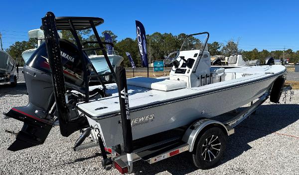 Slide: The Image of 2024 Hewes 18 Redfisher boat with Yamaha outboard motor on trailer. - 1