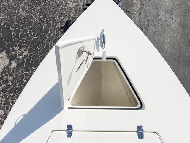 Slide: The Image of 2024 Hewes Redfisher 18 boat storage compartment, open hatch on deck. - 34