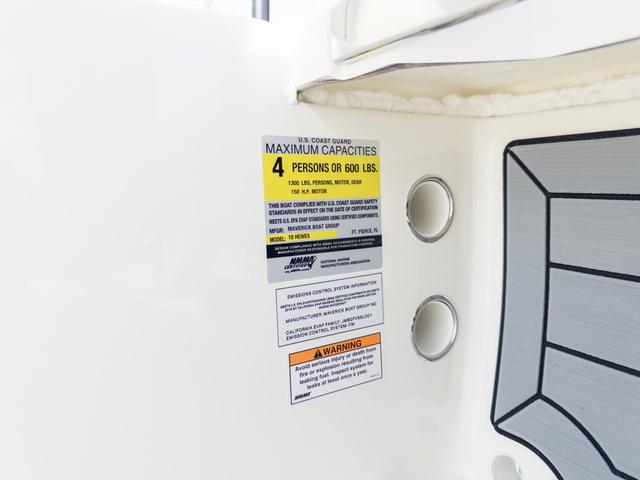 Slide: The Image of 2024 Hewes Redfisher 18 capacity label, maximum 4 persons or 600 lbs. - 35