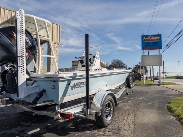 Slide: The Image of 2024 Hewes Redfisher 18 boat on trailer outside dealership. - 7