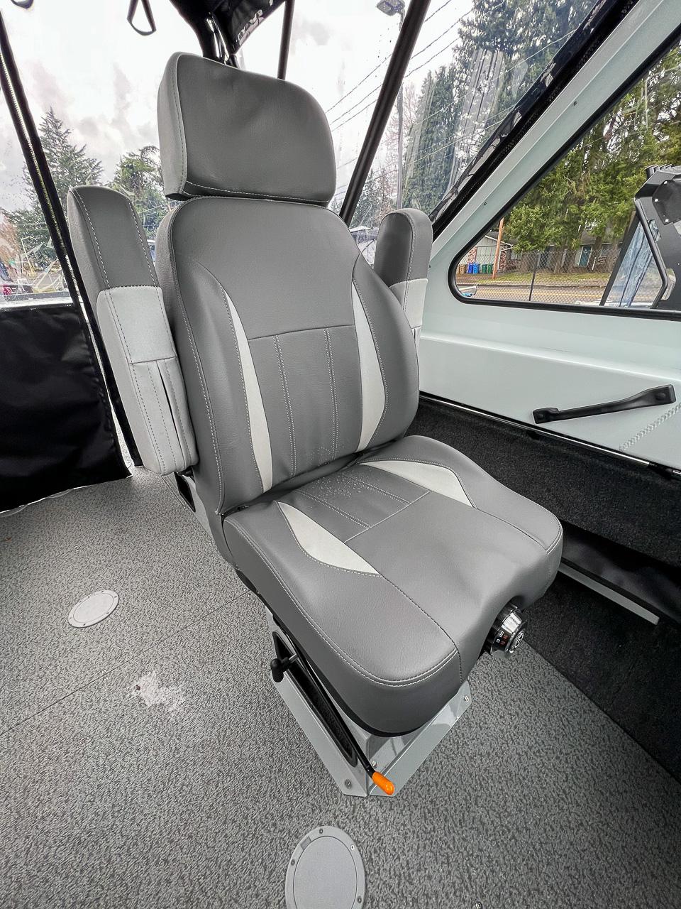 Slide: The Image of Captain's chair inside 2023 Hewescraft 190 Sea Runner boat, featuring grey upholstery and adjustable base. - 11