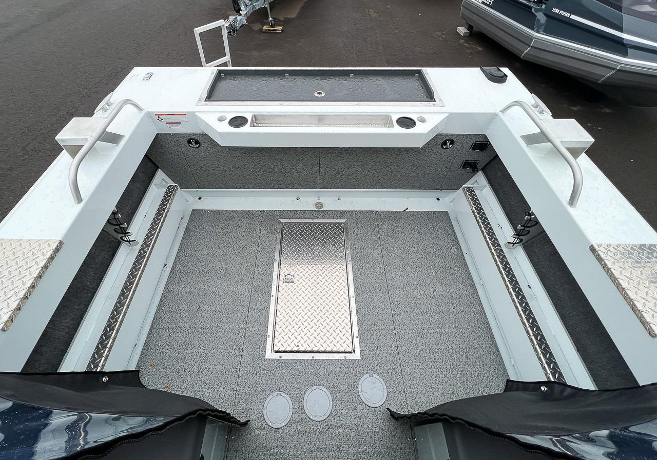 Slide: The Image of 2023 Hewescraft 190 Sea Runner boat interior with storage compartments and non-slip flooring. - 13