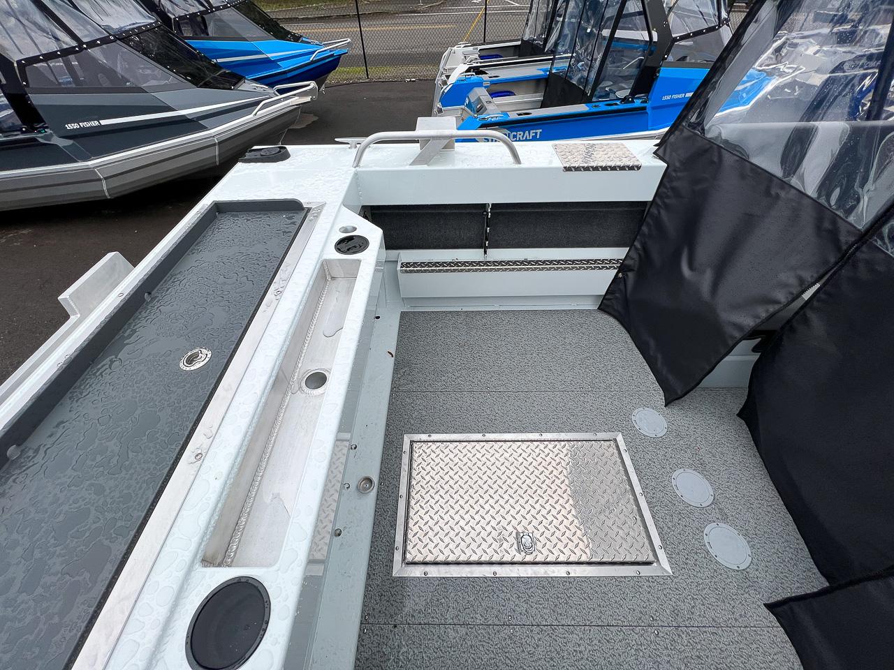 Slide: The Image of 2023 Hewescraft 190 Sea Runner interior, showing spacious deck and storage compartments. - 14