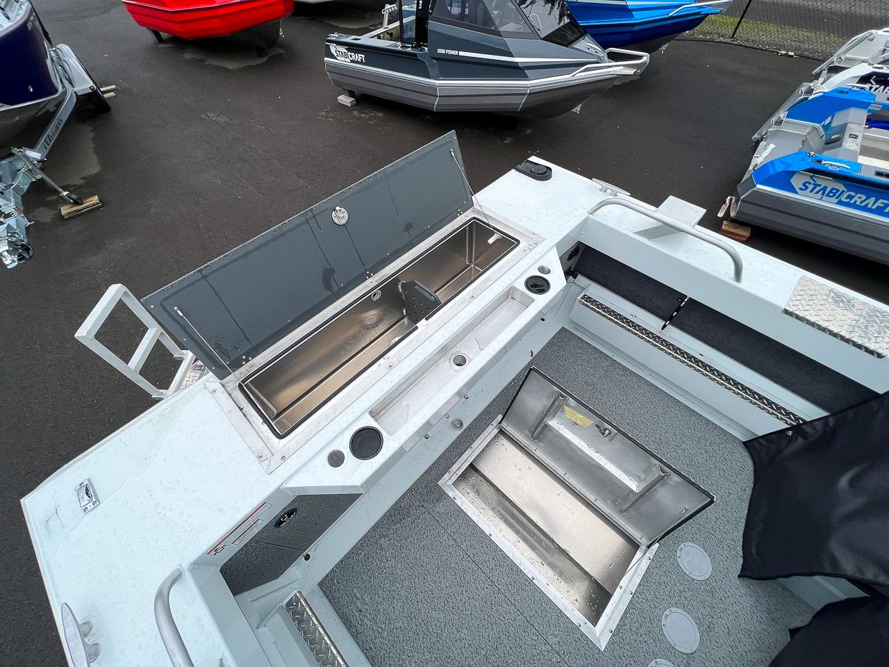 Slide: The Image of 2023 Hewescraft 190 Sea Runner boat interior with open storage compartments. - 16