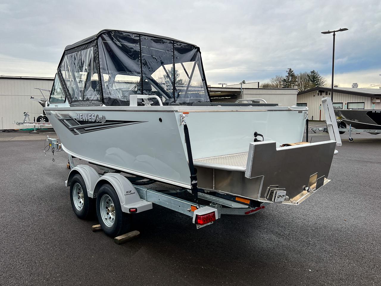 Slide: The Image of 2023 Hewescraft 190 Sea Runner boat on a trailer, rear view. - 5