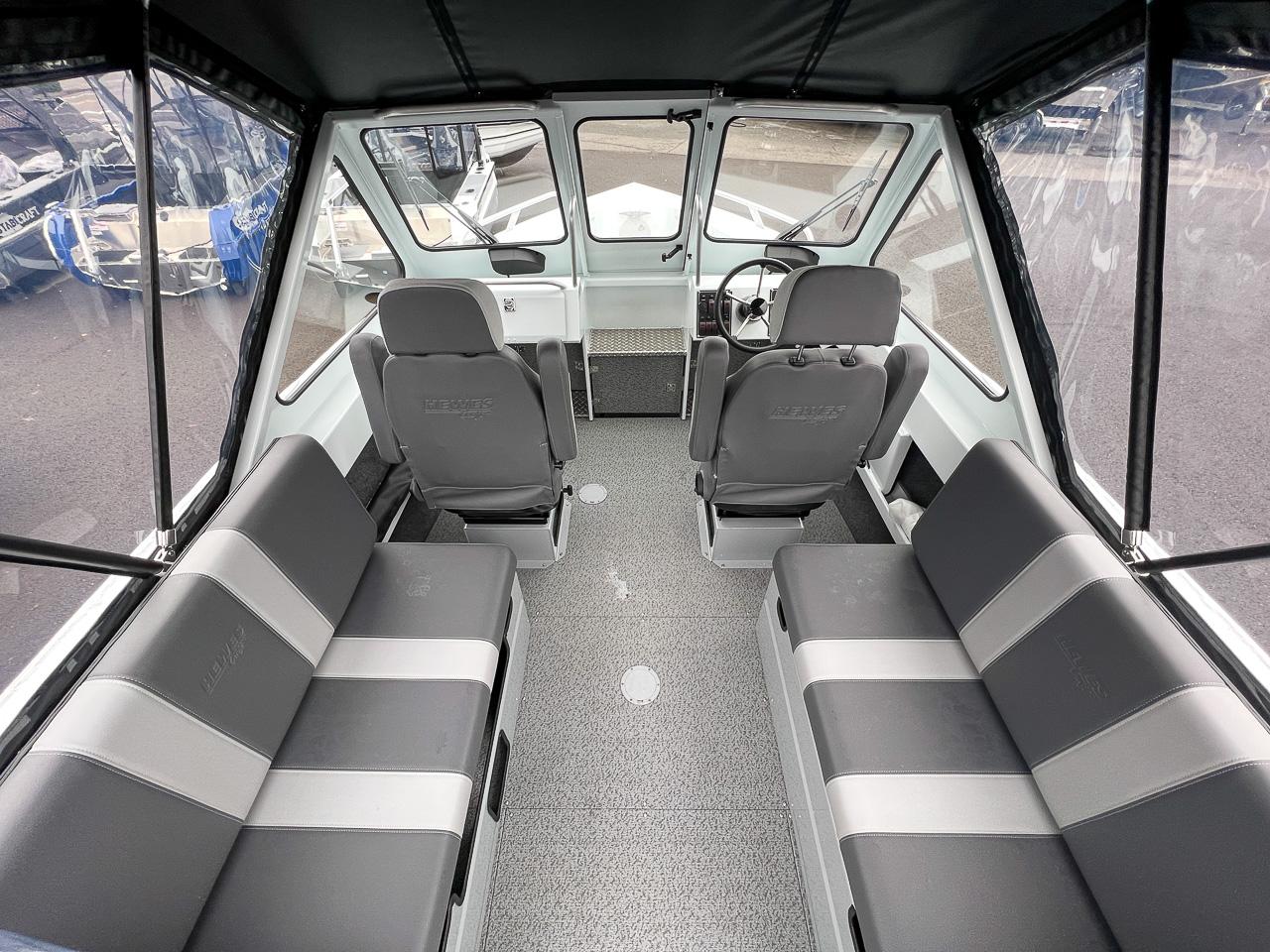 Slide: The Image of Interior of 2023 Hewescraft 190 Sea Runner boat with seating and steering console. - 8
