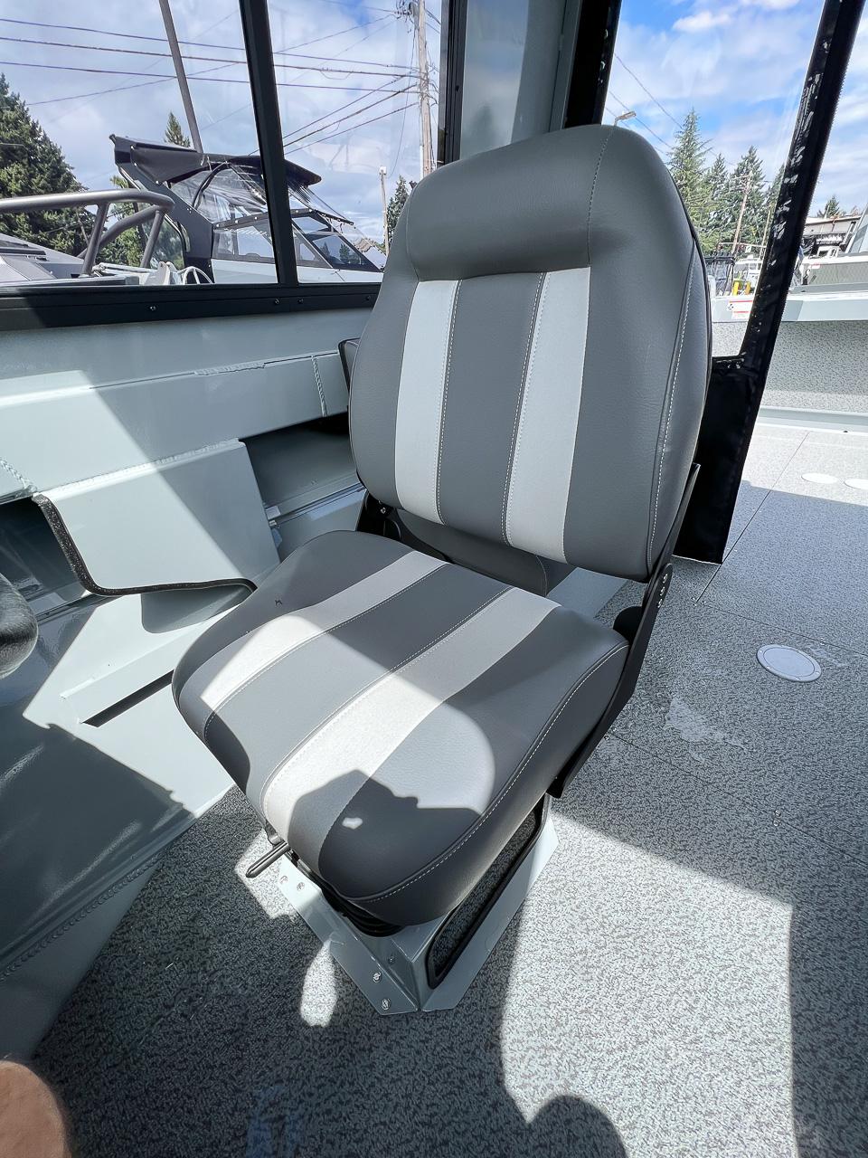 Slide: The Image of 2023 Hewescraft 200 Pro-V ET HT boat interior with a gray and white captain's chair. - 10