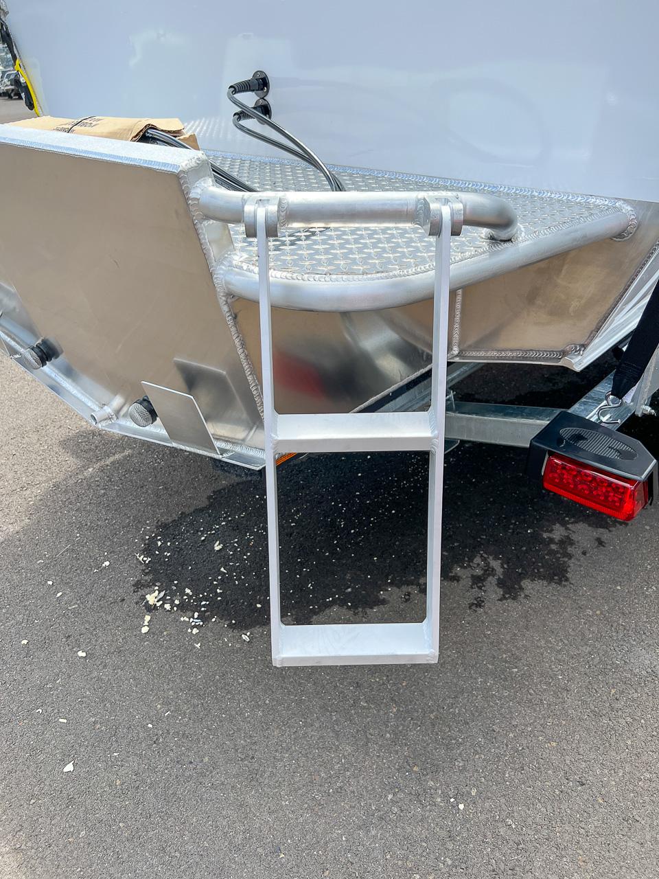 Slide: The Image of 2023 Hewescraft 200 Pro-V ET HT boat with rear ladder and aluminum finish. - 15